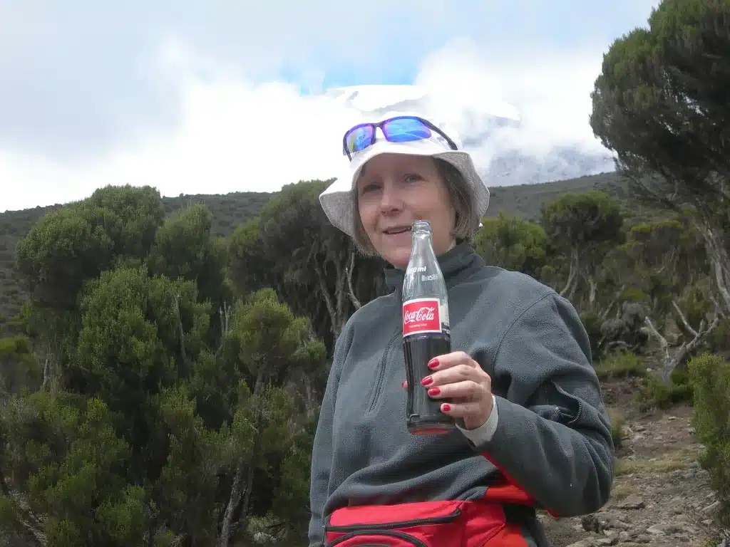 Drinking Coca-Cola along Marangu Route on Kilimanjaro
