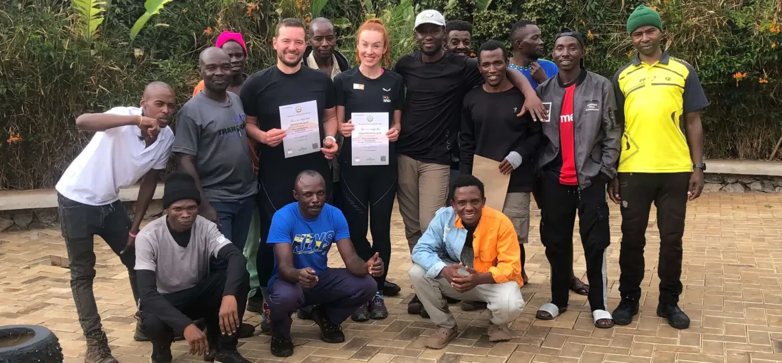 Lenka Poláčková and Jan receiving certificate after climbing Kilimanjaro in Africa
