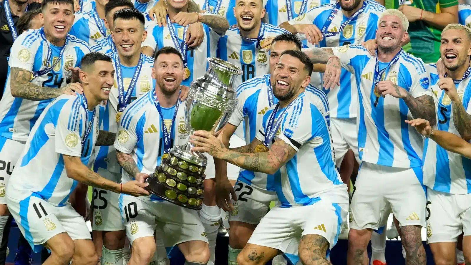 Lionel Messi celebrating with Argentina team cup