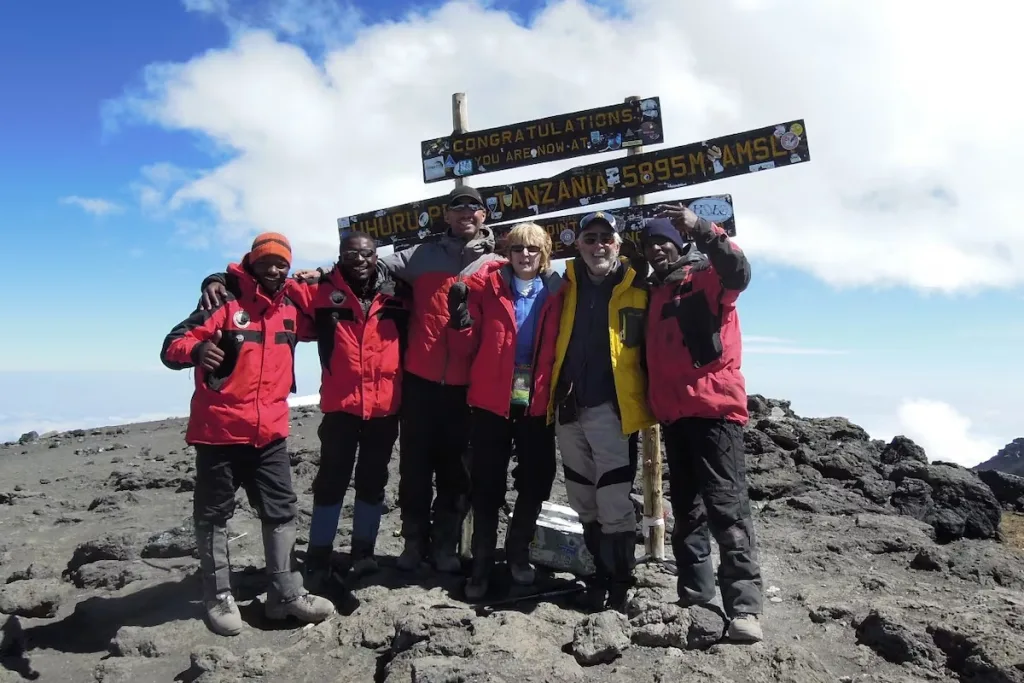 90 year old, Art Ulene on the summit of Kilimanjaro at Uhuru Peak