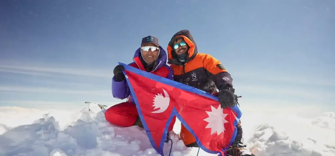 Nirmal Purja, sherpa and nepal flag on the peak