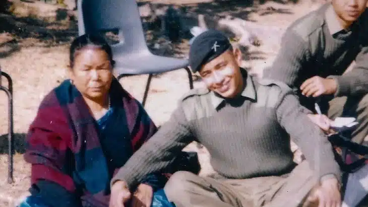 Young Nims Dai in the army with his mother.