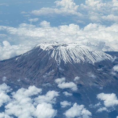 What is the height of Mount Kilimanjaro and how high is its highest point in meters or feet?