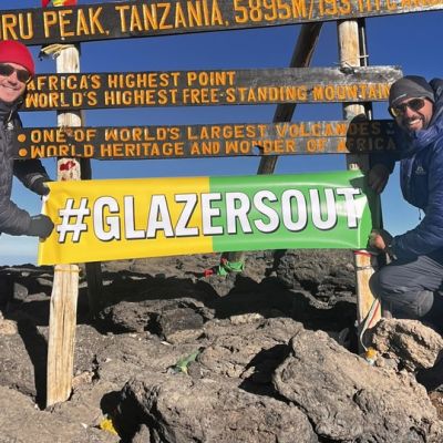 Manchester United fans display a ‘Glazers Out’ banner on top of Mount Kilimanjaro