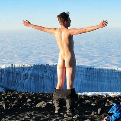 Climber poses naked on top of Mount Kilimanjaro