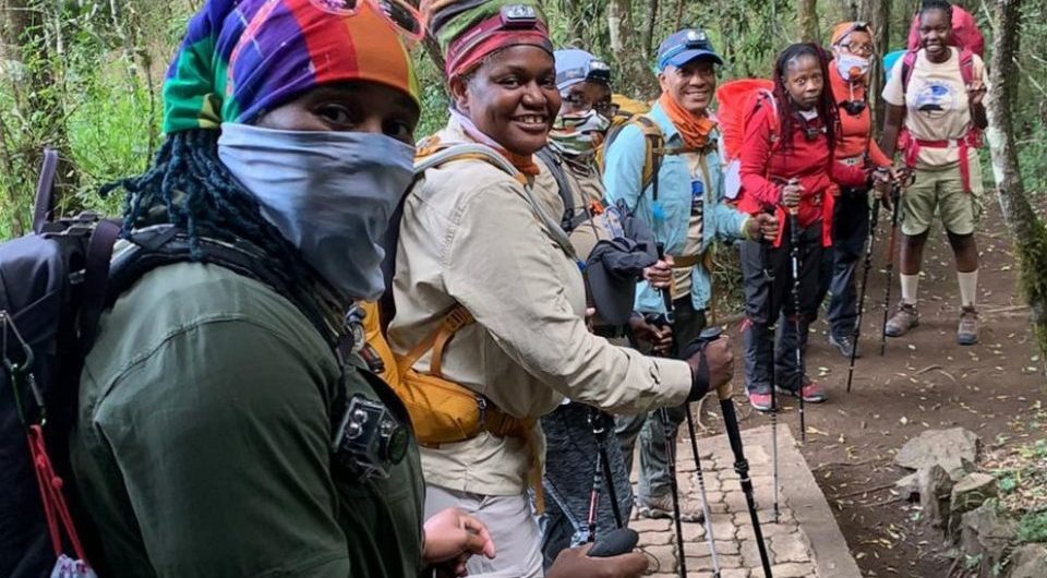 Group of balck women climbing Mount Kilimanjaro