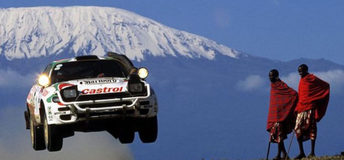 icon safari rally vehicle flying near Kilimanjaro