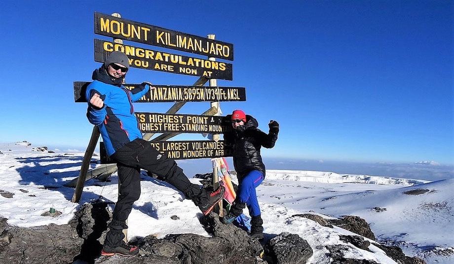 Standing on top of Kilimanjaro uhuru Peak