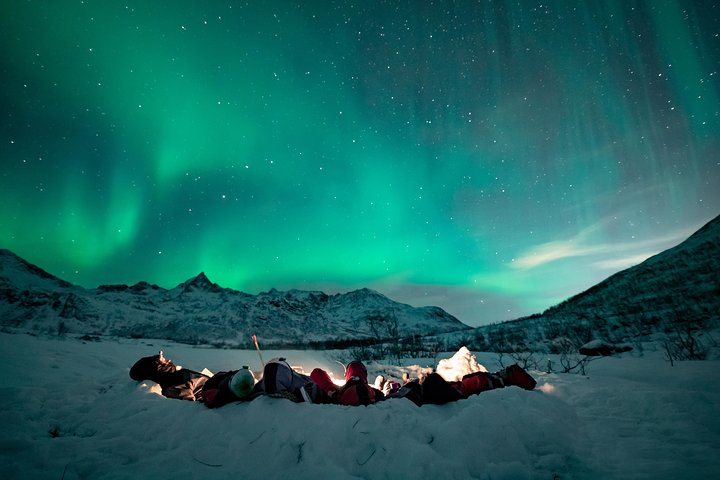 A starry sky with Northern Lights in Tromsø (Norway)